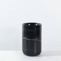 Large black marble cylindrical vase detail