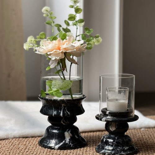 Full view of black marble and glass vase with floral arrangement