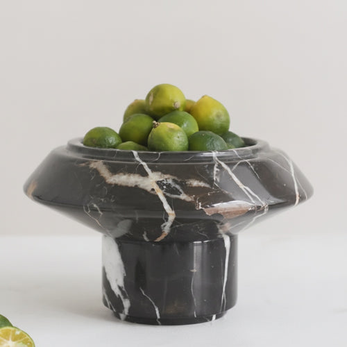 Side view of black marble footed bowl