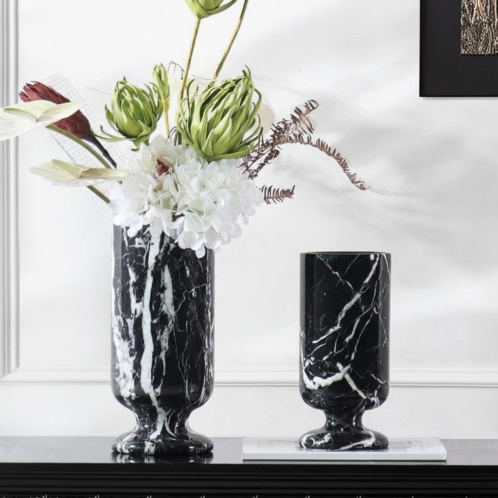 Black marble pedestal vase with floral arrangement