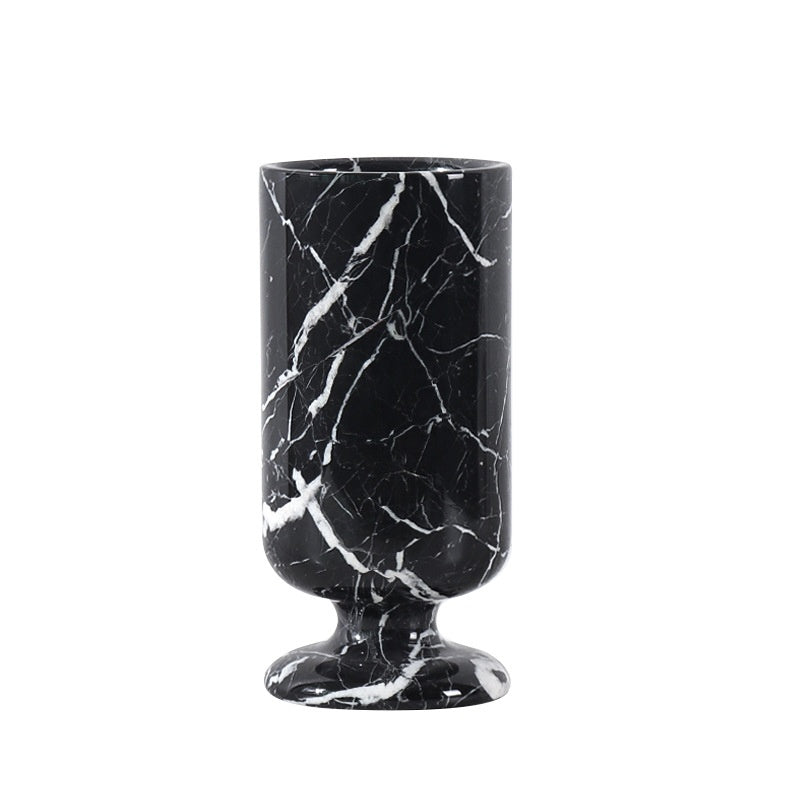 Solid black marble vase with white veining side view