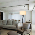 Modern geometric floor lamp in white living room setting