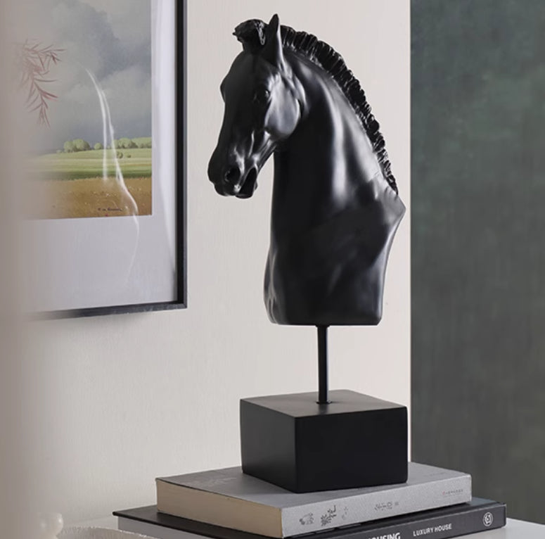 Front three quarter view of horse bust on books