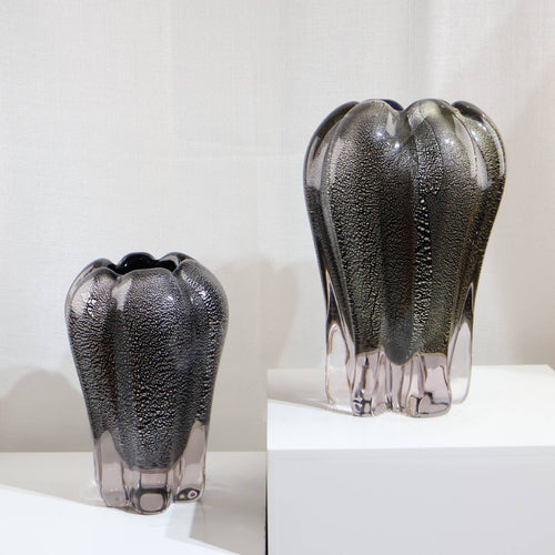 Group shot of large and medium speckled glass vases