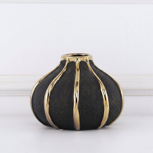 Front view of black textured vase with gold ribs