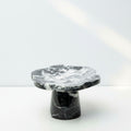 Black and white marble scalloped pedestal stand