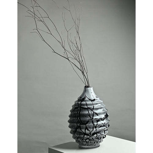 Medium ribbed glass vase with dried branches