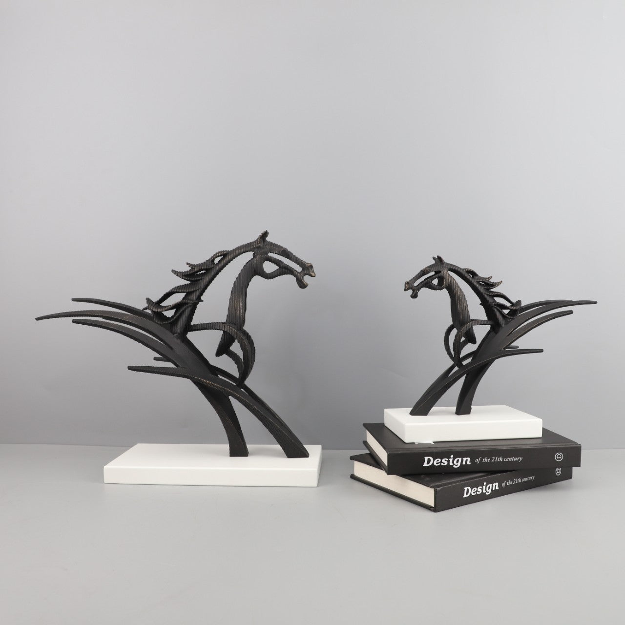 Side angle of the sculpture set showcasing dynamic galloping forms