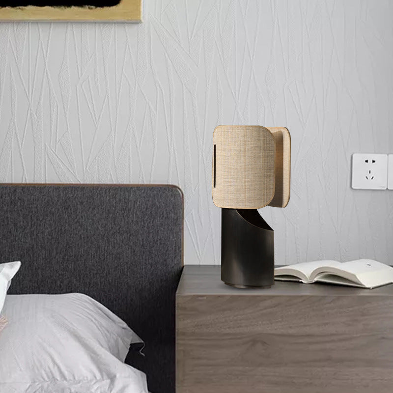 Lifestyle view of lamp on bedside table next to bed