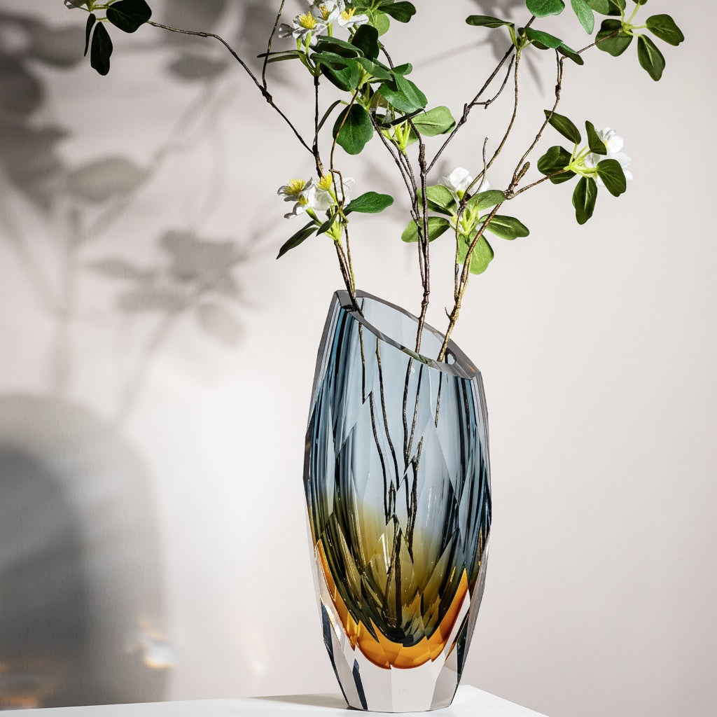 Side view of geometric gradient glass vase with flowers