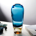 Front view of blue and amber glass vase