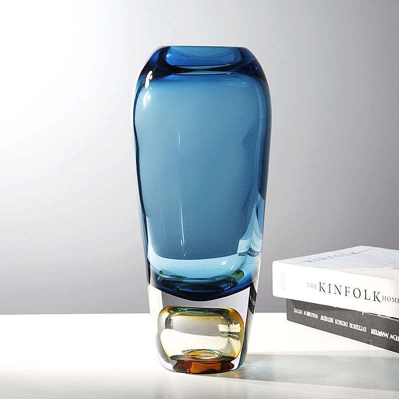 Angled view showing blue body and amber base detail