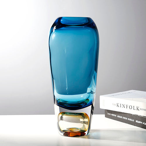 Angled view showing blue body and amber base detail