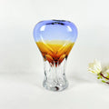 Medium blue and amber glass vase with sculpted clear base