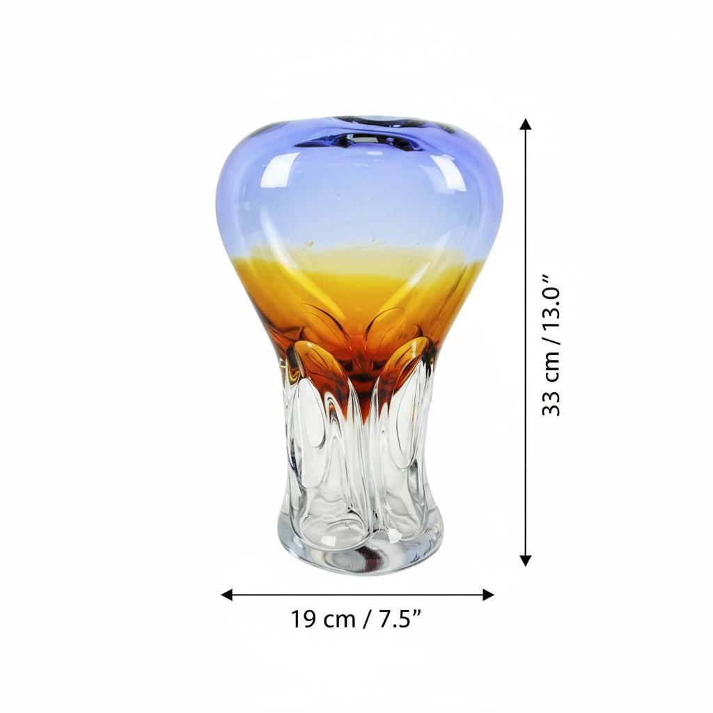 Two blue and amber art glass vases side by side