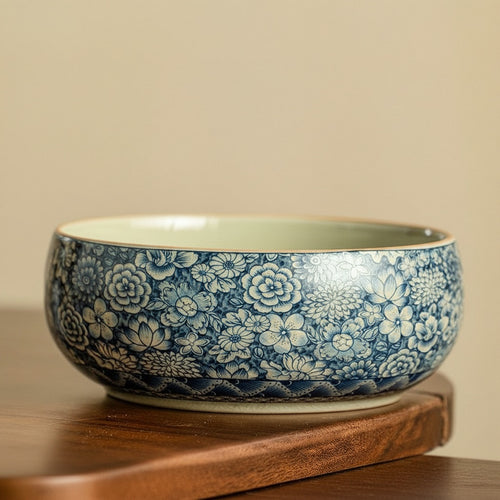 Blue and white floral ceramic serving bowl with smooth glazed interior