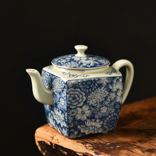 Angled view of blue and white square teapot