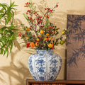 Blue And White Porcelain Fluted Vase with Floral Arrangement