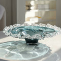 Blue art glass centerpiece bowl with textured wave rim side view