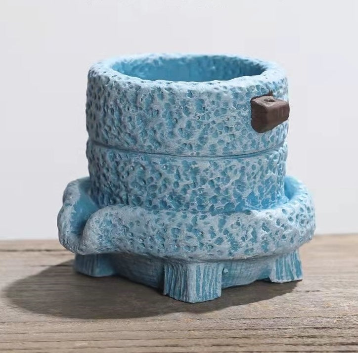 Textured blue ceramic planter side view