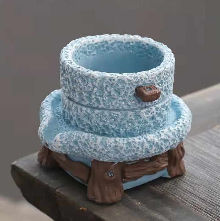 Top view of empty blue stone mill pot