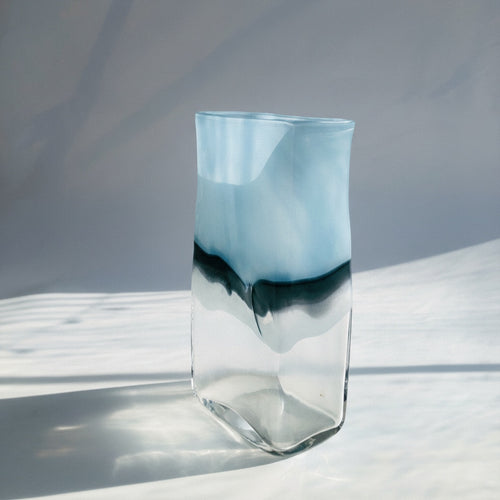 Front view of rectangular blue and clear art glass vase