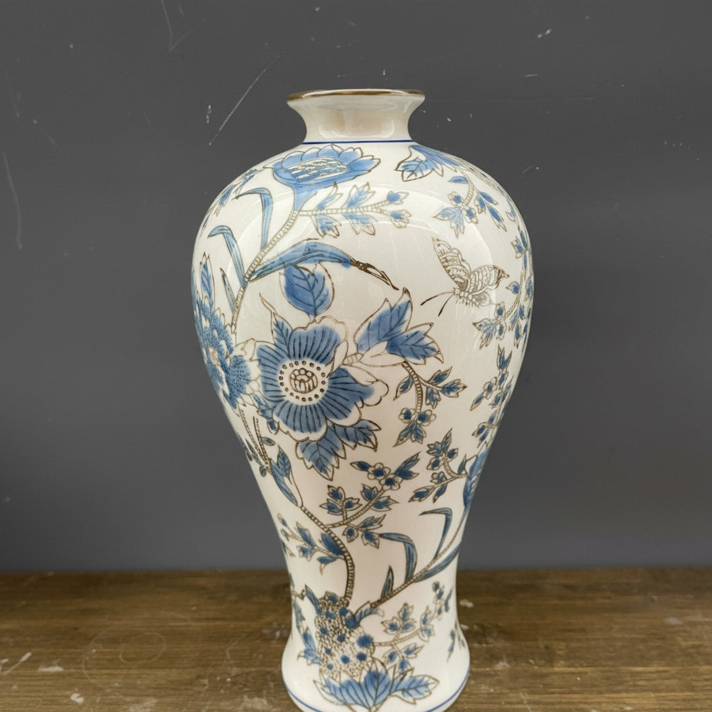 Blue and cream ceramic baluster vase with floral pattern