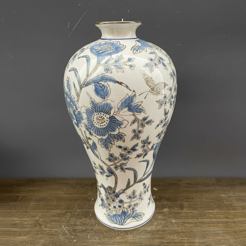 Blue and cream ceramic baluster vase with floral pattern