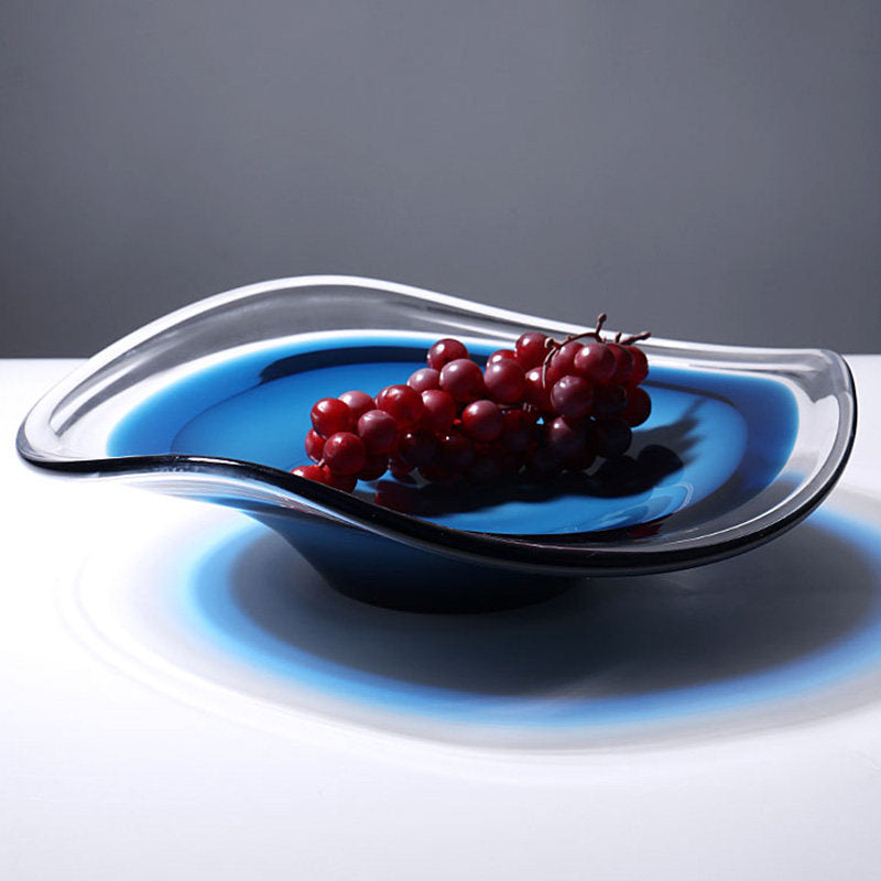 Side view of blue crystal bowl with fruit