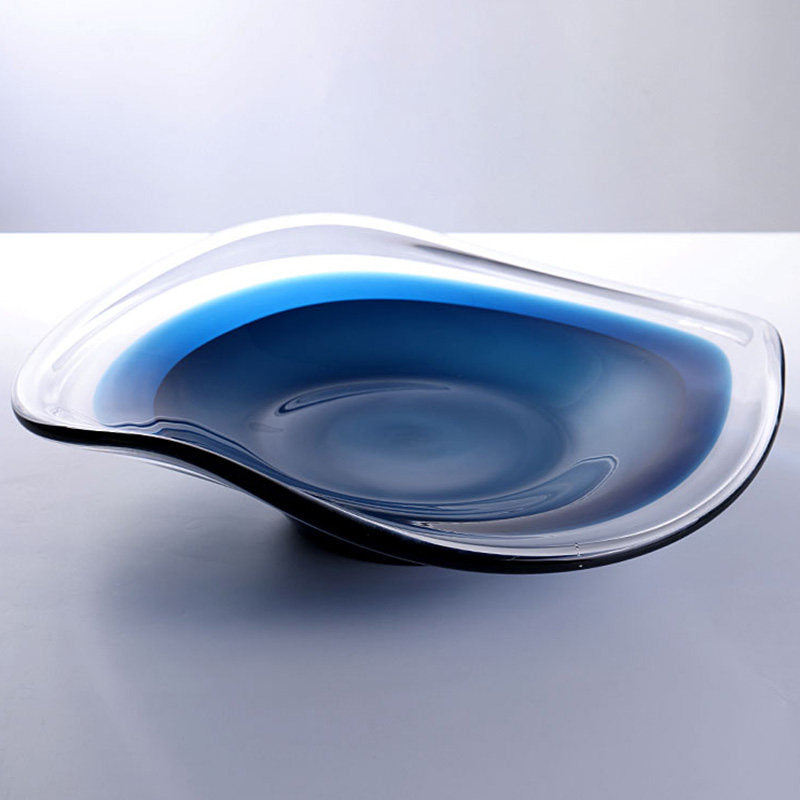 High angle view of empty blue crystal bowl showing depth