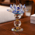 Front view of blue and clear crystal lotus candle holder on wooden table