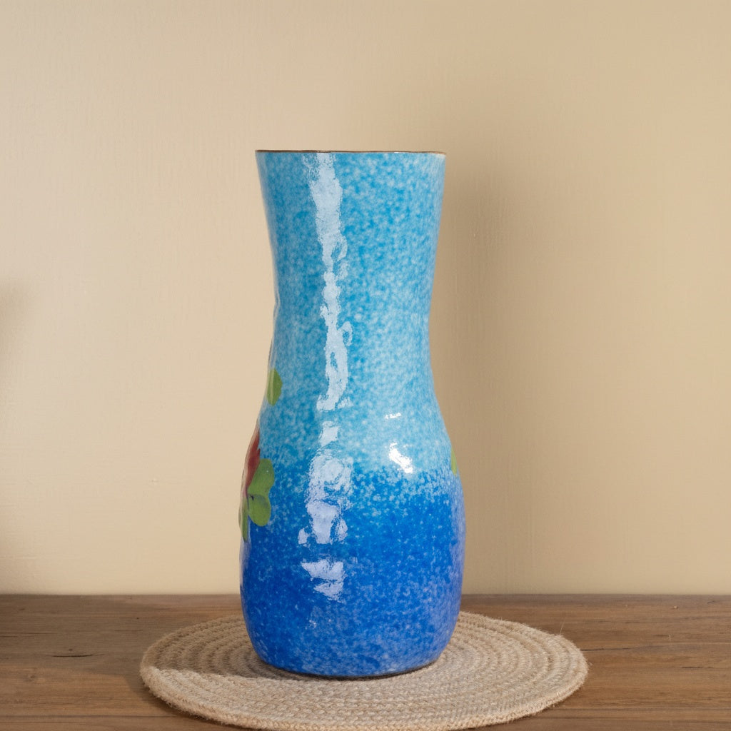 Side view of tapered blue vase showing textured finish