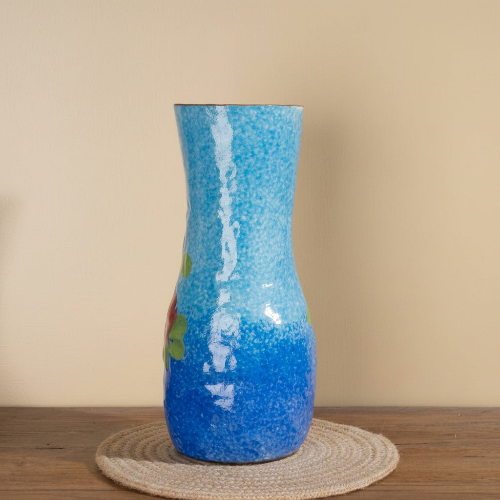 Alternate angle of blue floral vase with glossy surface