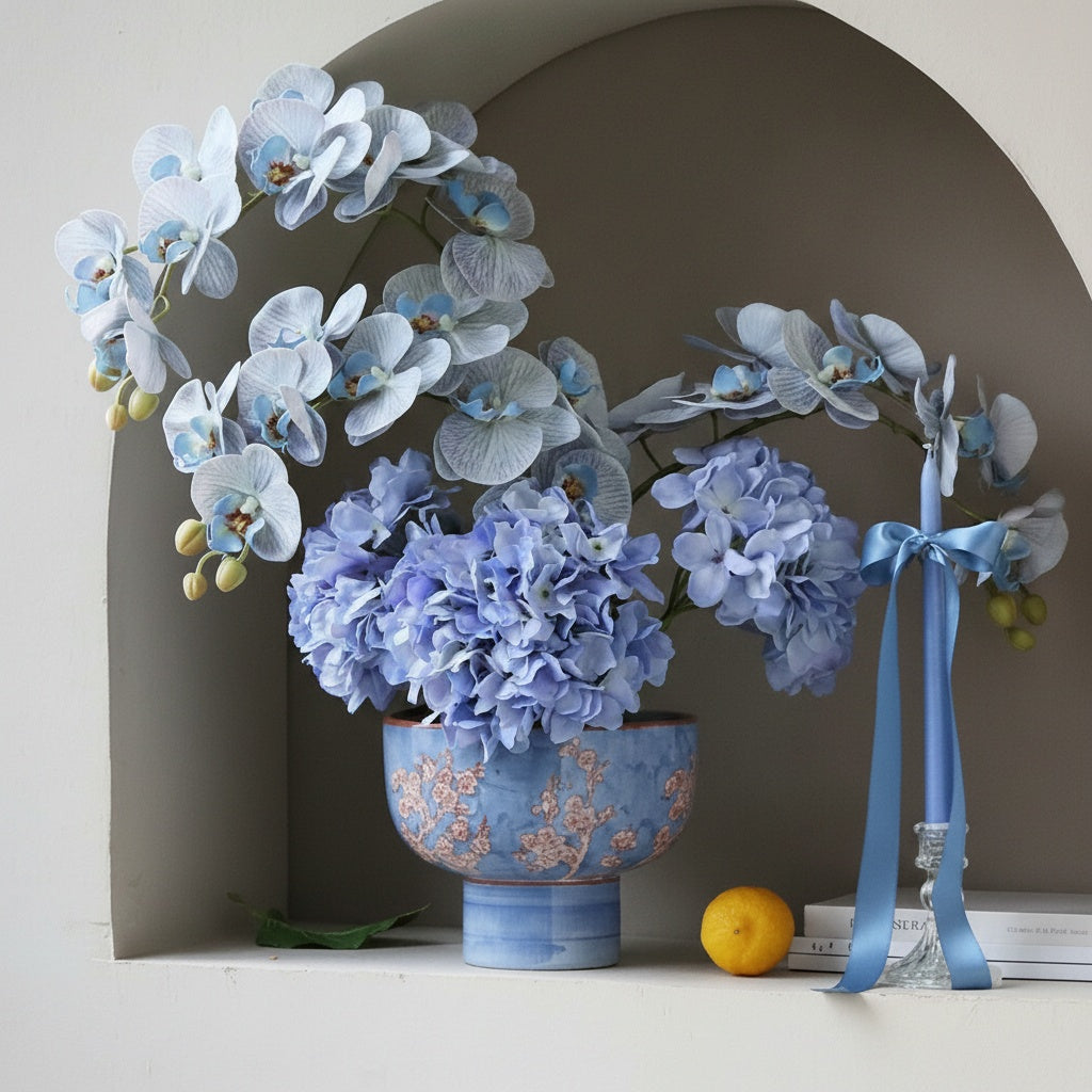 Decorative blue ceramic footed bowl with floral pattern