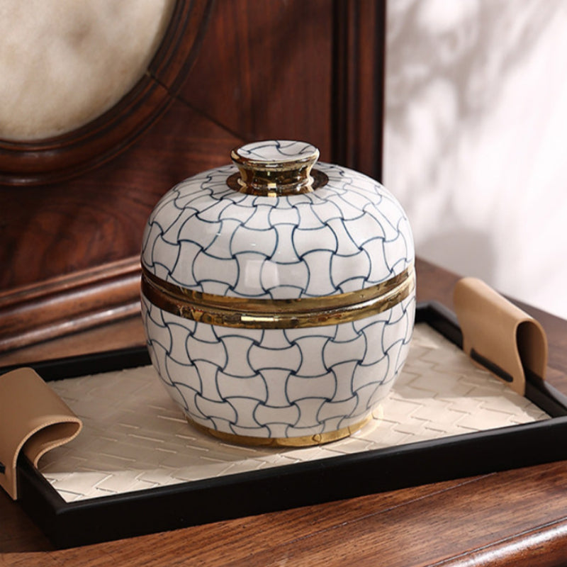 Blue and white ceramic jar on leather tray