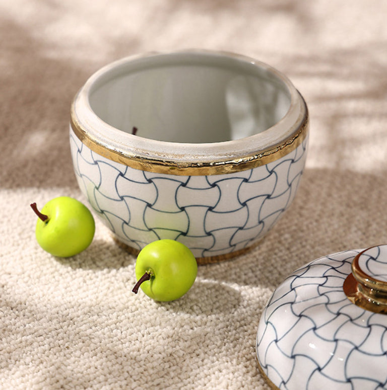 Top view of open ceramic jar with gold rim
