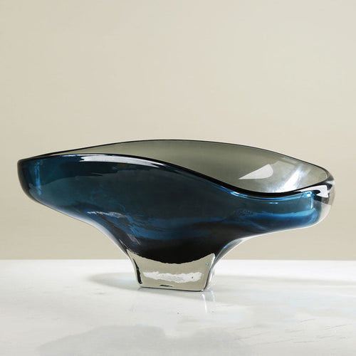 Side profile showing thick clear glass base and organic curve