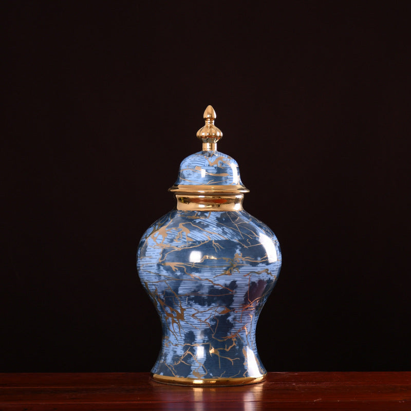 Large blue ceramic ginger jar with gold details