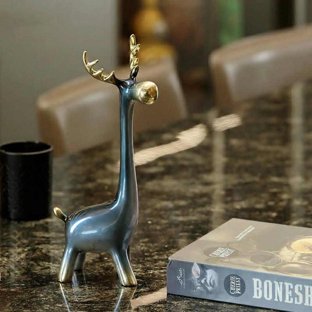 Blue and gold gradient ceramic reindeer figurine side view on table