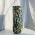 Front view of tall cylindrical blue and gold art glass vase