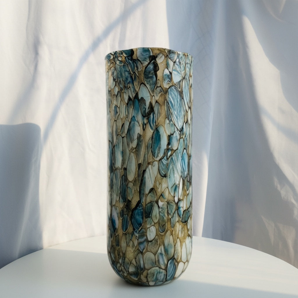 Front view of tall cylindrical blue and gold art glass vase