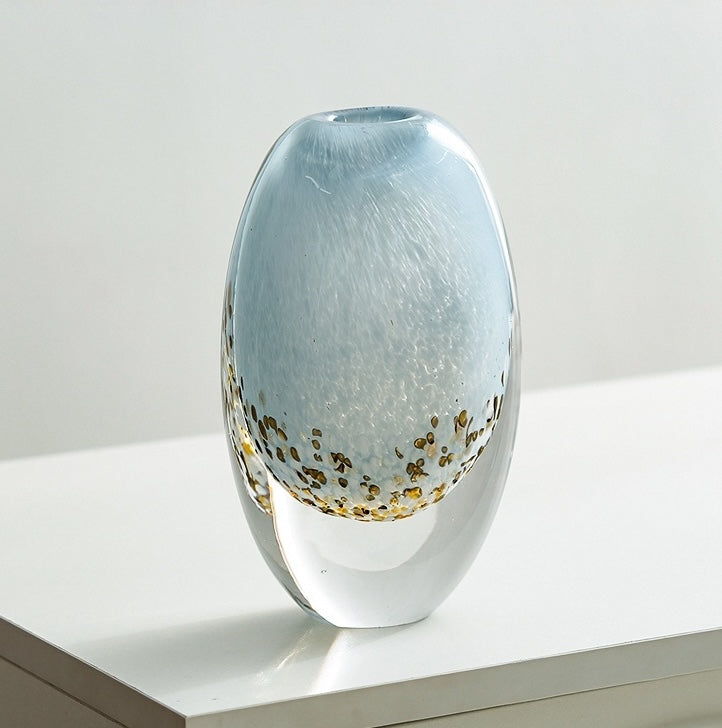 Tall oval blue glass vase with gold speckles front view