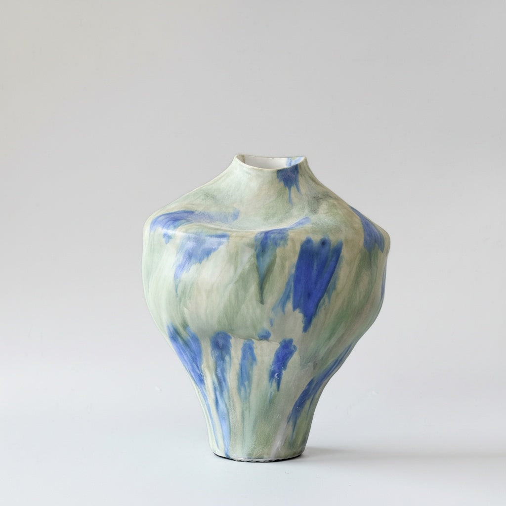Large organic shaped ceramic vase with blue and green drip glaze