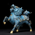 Front view of blue patinated copper Qilin statue with gold accents
