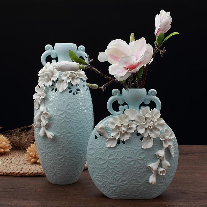Pale blue porcelain vase set with white floral applique and lattice details