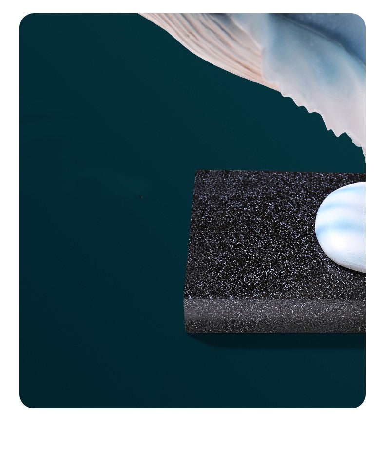 Close up detail of the black speckled base and wave support