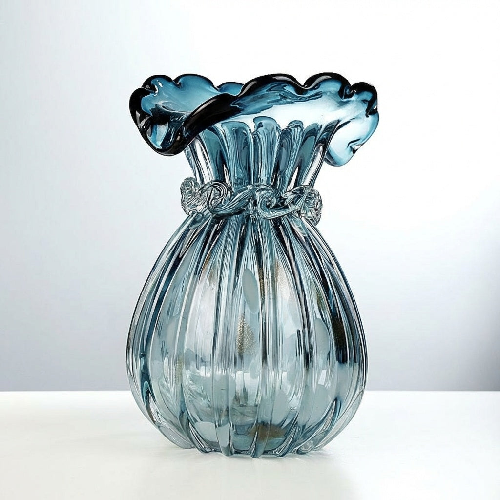 Side view of the blue glass vase on a white surface