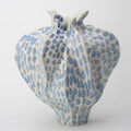 Front view of blue and white spotted ceramic pomegranate vase