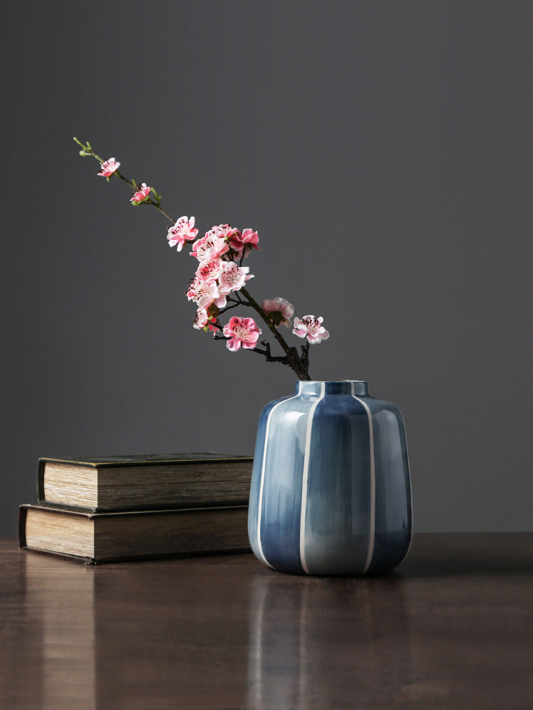 Short blue striped ceramic jar vase with pink flowers