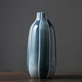 Detail of tall blue glazed ceramic vase